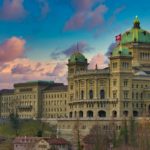 brown concrete building under blue sky