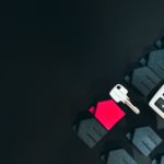 A cell phone sitting on top of a keyboard