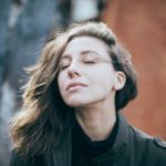 closeup photo of woman wearing black top