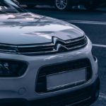 white and black car on road during daytime